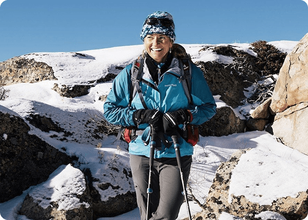 Woman hiking in snowy mountains
