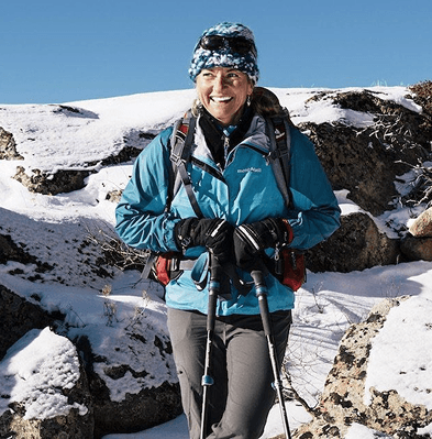 Woman hiking in snowy mountains